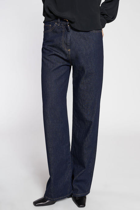 Jeans largo dark blue con impunture in cuoio